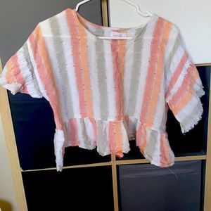 Orange, white and grey striped top.